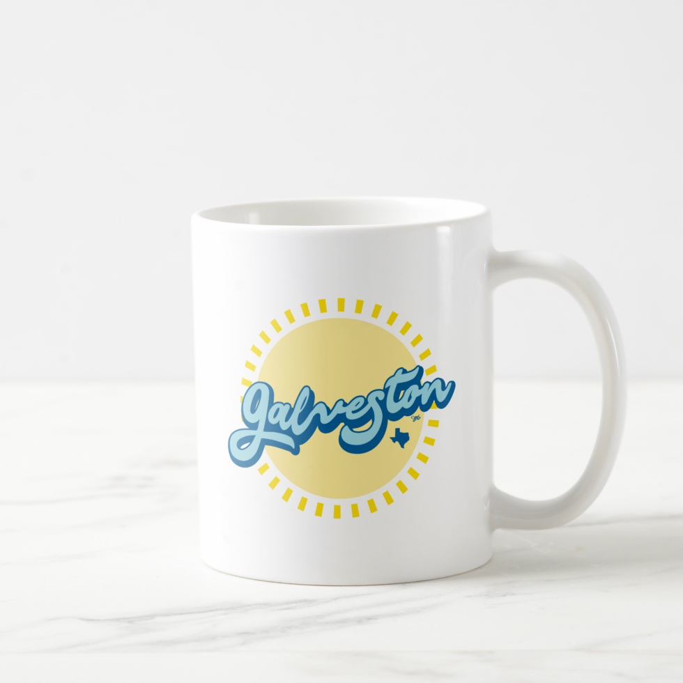 Galveston Island, Texas coffee mug featuring a radiant sun and the name 'Galveston' in bold blue letters with the state of Texas symbol. Perfect for sipping your favorite brew while reminiscing about sunny days on the island. Click to purchase.